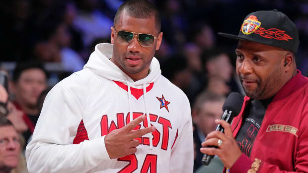 Feb 18, 2024; Indianapolis, Indiana, USA; Denver Broncos quarterback Russell Wilson looks on before the 73rd NBA All Star game at Gainbridge Fieldhouse. Mandatory Credit: Kyle Terada-USA TODAY Sports  